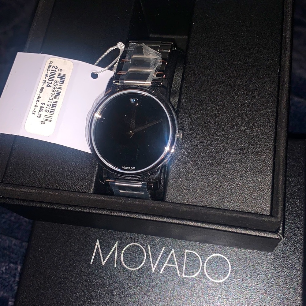 Silver watch with black face brand new still has all the plastic on the watch.